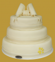 tort weselny w stylu angielskim 3 piętrowy z kokardą i łapką