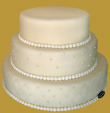 tort weselny 3 piętrowy okrągły w białej czekoladzie bardzo subtelny