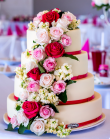 tort weselny 4 piętrowy w białej plastycznej czekoladzie + spadające kwiaty