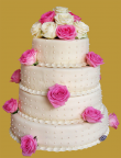 tort weselny 4 piętrowy na wbudowanym stelażu w białej plastycznej czekoladzie z żywymi różami